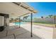 A lovely backyard features a covered patio and a refreshing private swimming pool at 716 Vincent Way, Las Vegas, NV 89145