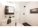 Modern bathroom with stylish dark fixtures, subway tile, and a walk-in shower with decorative accent tile at 716 Vincent Way, Las Vegas, NV 89145