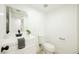 Powder room with a sleek sink, updated faucet, a modern mirror and decorative elements at 716 Vincent Way, Las Vegas, NV 89145