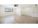 Bright, spacious bedroom featuring sleek floors, a large window, and ample natural light at 716 Vincent Way, Las Vegas, NV 89145