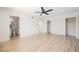 Spacious bedroom features a ceiling fan, walk-in closet, and ensuite bathroom with hardwood style floors at 716 Vincent Way, Las Vegas, NV 89145