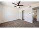 Bedroom with neutral carpet, base molding, a ceiling fan and a sliding-door closet at 716 Vincent Way, Las Vegas, NV 89145
