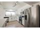 Modern kitchen featuring stainless steel appliances, sleek white cabinetry, and a stylish design at 716 Vincent Way, Las Vegas, NV 89145