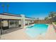 Bright blue swimming pool features easy access steps and plenty of space to relax by the poolside at 716 Vincent Way, Las Vegas, NV 89145