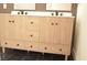 Bathroom vanity with stylish black accents and modern wood cabinetry at 7253 Alsop Ct, Las Vegas, NV 89156