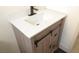 Modern bathroom featuring a rustic vanity and white countertop with a black faucet at 7253 Alsop Ct, Las Vegas, NV 89156