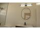 Bathroom features a sleek mirror and modern lighting fixture above the vanity at 7253 Alsop Ct, Las Vegas, NV 89156