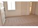 Bright bedroom features neutral carpeting, a closet, a door to another room, and a window at 7253 Alsop Ct, Las Vegas, NV 89156