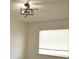 Bedroom featuring a modern light fixture and a window at 7253 Alsop Ct, Las Vegas, NV 89156