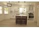 Modern kitchen with white cabinets, stainless steel appliances, and a center island at 7253 Alsop Ct, Las Vegas, NV 89156