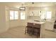 Modern kitchen with white cabinets, stainless steel appliances, and a center island at 7253 Alsop Ct, Las Vegas, NV 89156