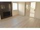 Living room featuring a modern black marble fireplace and access to a patio at 7253 Alsop Ct, Las Vegas, NV 89156