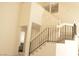 Bright living room with vaulted ceilings, a staircase, and an upstairs view at 7253 Alsop Ct, Las Vegas, NV 89156