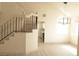 Bright living room with vaulted ceilings, wood floors, and a view of the kitchen at 7253 Alsop Ct, Las Vegas, NV 89156