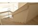 Staircase with wood stairs and modern black metal railing at 7253 Alsop Ct, Las Vegas, NV 89156