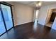 The bedroom boasts hardwood floors, a ceiling fan, and sliding glass door access to the patio at 8455 W Sahara Ave # 213, Las Vegas, NV 89117