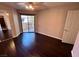 Bedroom featuring a sliding glass door to a balcony, hardwood floors, and ample natural light at 8455 W Sahara Ave # 213, Las Vegas, NV 89117