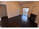 A well-lit living room with hardwood floors, a fireplace, and access to a private patio at 8455 W Sahara Ave # 213, Las Vegas, NV 89117