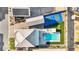 Aerial view of home showcasing pool, tennis court, putting green, and solar panels at 8528 Baltimore Heights Ct, Las Vegas, NV 89113