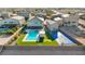 Aerial view of the property highlighting the pool, tennis court, putting green, and manicured landscaping at 8528 Baltimore Heights Ct, Las Vegas, NV 89113