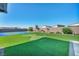 Well-manicured lawn and a sports court creates a great outdoor space for recreation and entertaining at 8528 Baltimore Heights Ct, Las Vegas, NV 89113