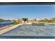 Expansive backyard featuring a pool with a spa, outdoor kitchen, and plenty of space for entertaining and recreation at 8528 Baltimore Heights Ct, Las Vegas, NV 89113