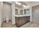 This bathroom offers a double sink vanity, tiled floors, and a toilet at 8528 Baltimore Heights Ct, Las Vegas, NV 89113