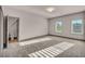 Spacious bedroom with plush carpeting and natural light from the window at 8528 Baltimore Heights Ct, Las Vegas, NV 89113