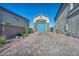 Long paver driveway approaching a detached garage provides ample parking at 8528 Baltimore Heights Ct, Las Vegas, NV 89113