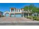Beautiful two-story home showcasing a well-manicured front yard and a three-car garage at 8528 Baltimore Heights Ct, Las Vegas, NV 89113