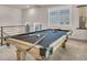 Game room featuring a wood pool table and ample natural light at 8528 Baltimore Heights Ct, Las Vegas, NV 89113