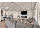 The living room has a cozy sectional sofa, modern fireplace, and a coffered ceiling at 8528 Baltimore Heights Ct, Las Vegas, NV 89113