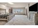 Spacious main bedroom with a large bed, carpet flooring, and multiple windows providing ample natural light at 8528 Baltimore Heights Ct, Las Vegas, NV 89113