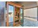 Exterior view of the sauna. It has a glass door that leads to a covered patio at 8528 Baltimore Heights Ct, Las Vegas, NV 89113