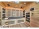 The sauna features wood construction and a cushioned bench, perfect for relaxing after a long day at 8528 Baltimore Heights Ct, Las Vegas, NV 89113