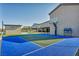 An outdoor sports court with space to play basketball, pickleball, and more, creating a versatile recreation area for the whole Gathering at 8528 Baltimore Heights Ct, Las Vegas, NV 89113