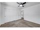 Bedroom featuring carpet, a ceiling fan with light, and closet with white doors at 8529 Gold Flash Ave, Las Vegas, NV 89129