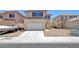 Charming two-story home with a two-car garage and desert landscaping at 8529 Gold Flash Ave, Las Vegas, NV 89129