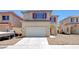Charming two-story home with a well-maintained front yard and attached two-car garage at 8529 Gold Flash Ave, Las Vegas, NV 89129
