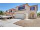 Inviting two-story home featuring a convenient two-car garage and neutral-toned exterior at 8529 Gold Flash Ave, Las Vegas, NV 89129