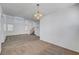 Spacious living room with high ceilings, neutral carpeting, and a chandelier at 8529 Gold Flash Ave, Las Vegas, NV 89129