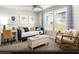 Cozy secondary bedroom with natural light, a daybed, and a dedicated workspace at 8683 Luxuriant Ave # Lot 26, Las Vegas, NV 89148