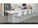 Modern kitchen with stainless steel appliances, quartz countertops and a large center island at 8683 Luxuriant Ave # Lot 26, Las Vegas, NV 89148