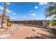 Private backyard featuring decorative rock landscaping and fence; Mountain views enhance this tranquil space at 8824 Killians Greens Dr, Las Vegas, NV 89131