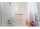 Bright bathroom with a white tub, a shower, and a floral shower curtain at 8824 Killians Greens Dr, Las Vegas, NV 89131