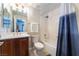 Bathroom features vanity with elegant fixtures, toilet, and shower/tub combination, offering a cozy space at 8824 Killians Greens Dr, Las Vegas, NV 89131
