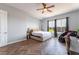 Comfortable bedroom featuring a bed, desk area, and a view of the outside at 8824 Killians Greens Dr, Las Vegas, NV 89131