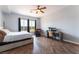 Bedroom featuring wood floors, a large window, and a work desk at 8824 Killians Greens Dr, Las Vegas, NV 89131