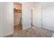 Neutral bedroom featuring a closet with shelving and carpet flooring at 8824 Killians Greens Dr, Las Vegas, NV 89131