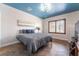 Bright bedroom with striking floors, a modern light fixture, and plenty of natural light at 8824 Killians Greens Dr, Las Vegas, NV 89131